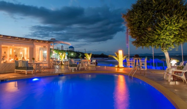Pool by night at Oasis Beach Hotel Spa