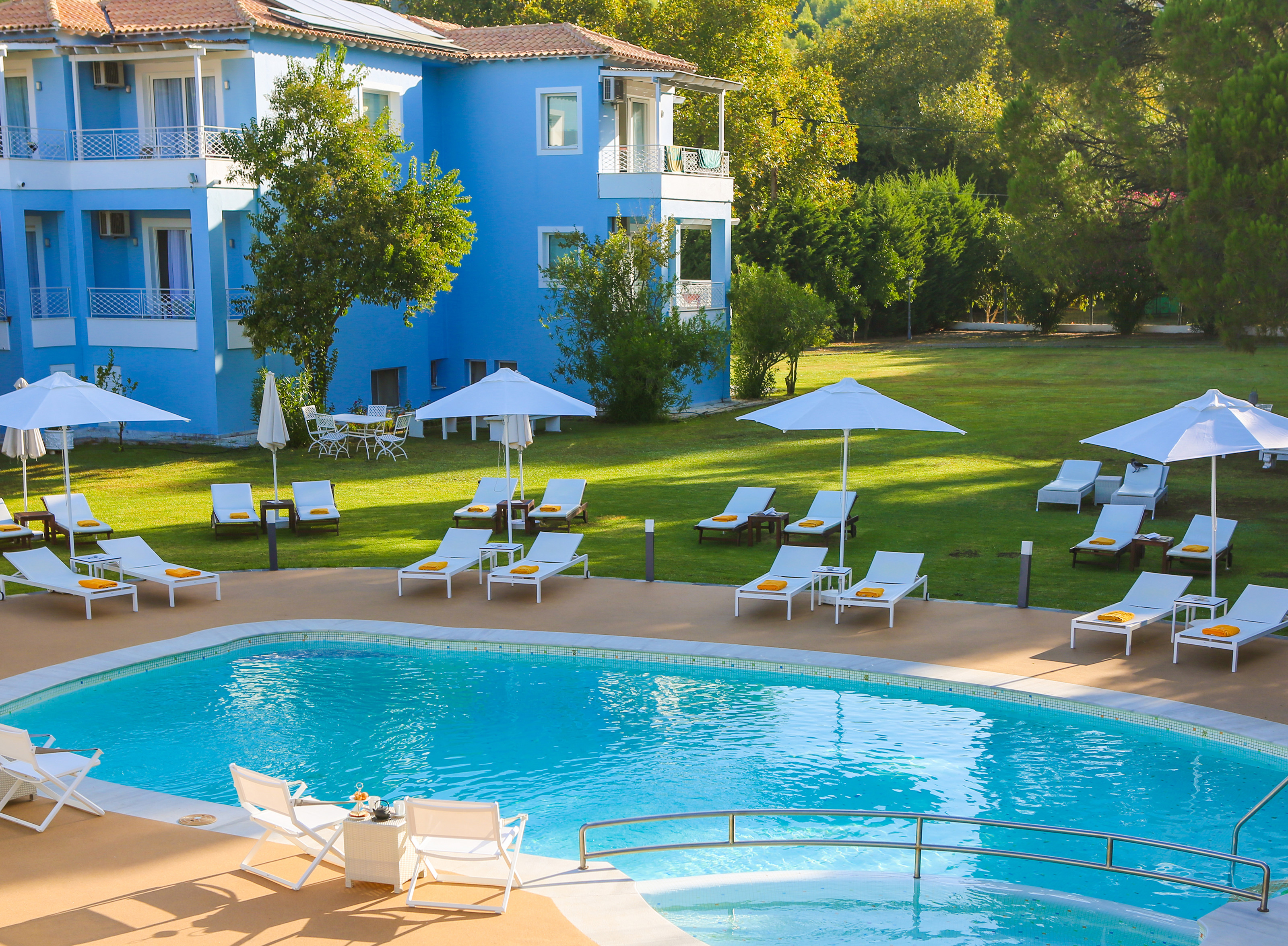 Pool area at Mandraki Village Boutique Hotel