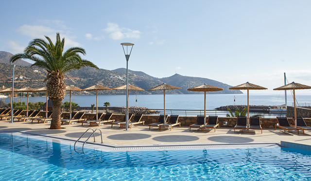 Pool with beach view at Wyndham Grand Crete Mirabello Bay